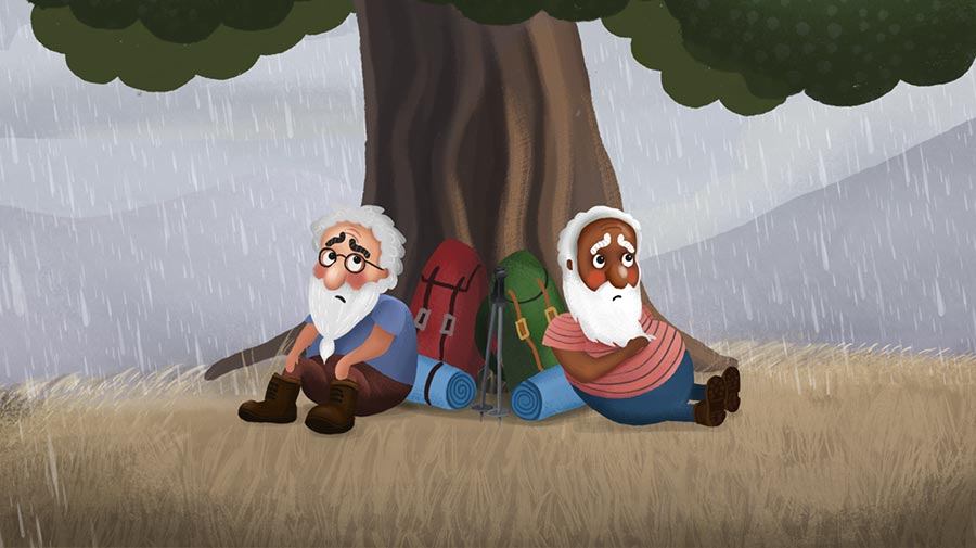 Two hikers sitting under a tree